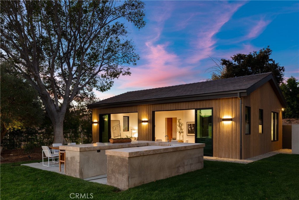 25151 Jim Bridger Road Hidden Hills, CA 91302 - Photo 32 of 32 a view of house with backyard and outdoor seating