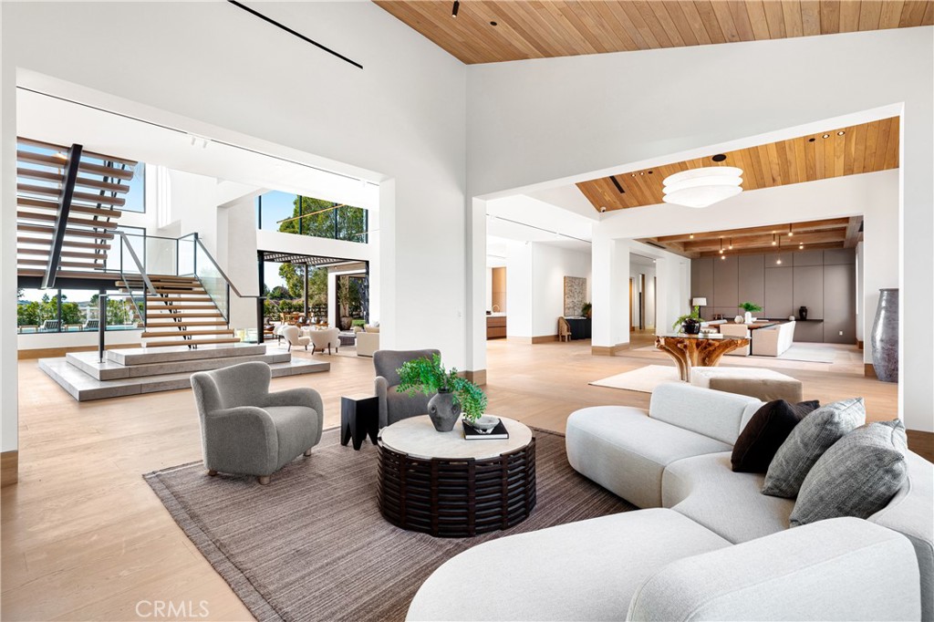25151 Jim Bridger Road Hidden Hills, CA 91302 - Photo 5 of 32 a living room with furniture and a large window