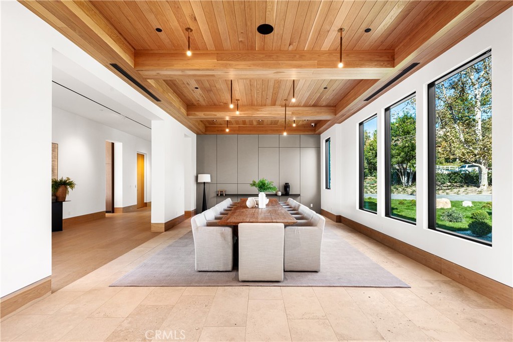 25151 Jim Bridger Road Hidden Hills, CA 91302 - Photo 10 of 32 a large room with pool table and windows