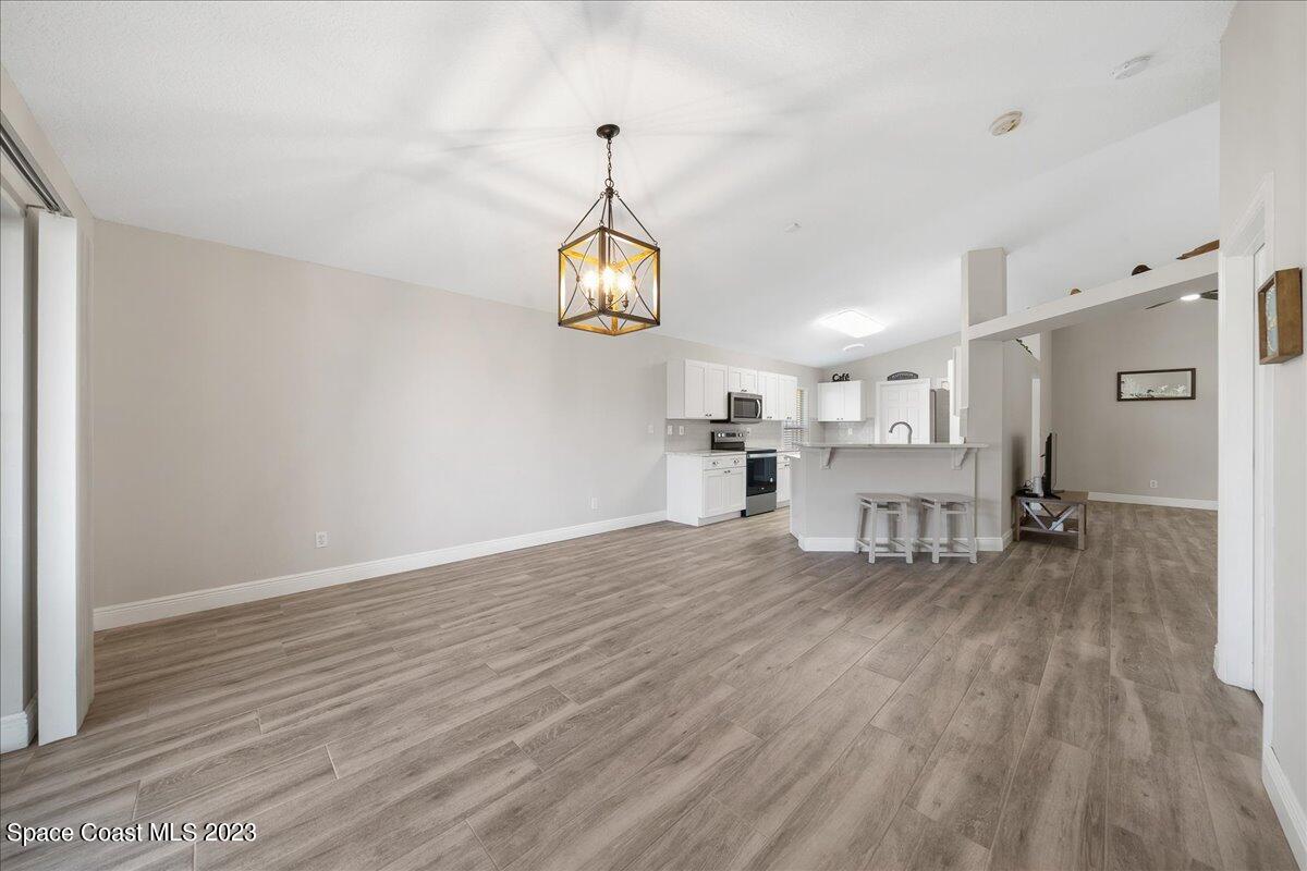 600 Benton Drive Melbourne, FL 32901 - Photo 14 of 33 a living room with furniture and a wooden floor