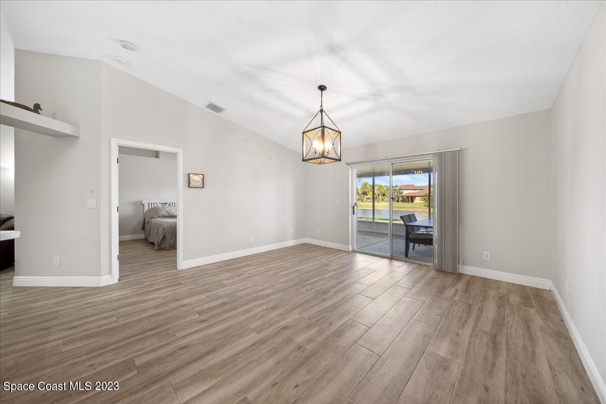 600 Benton Drive Melbourne, FL 32901 - Photo 16 of 33 a view of a room with wooden floor staircase and a living room