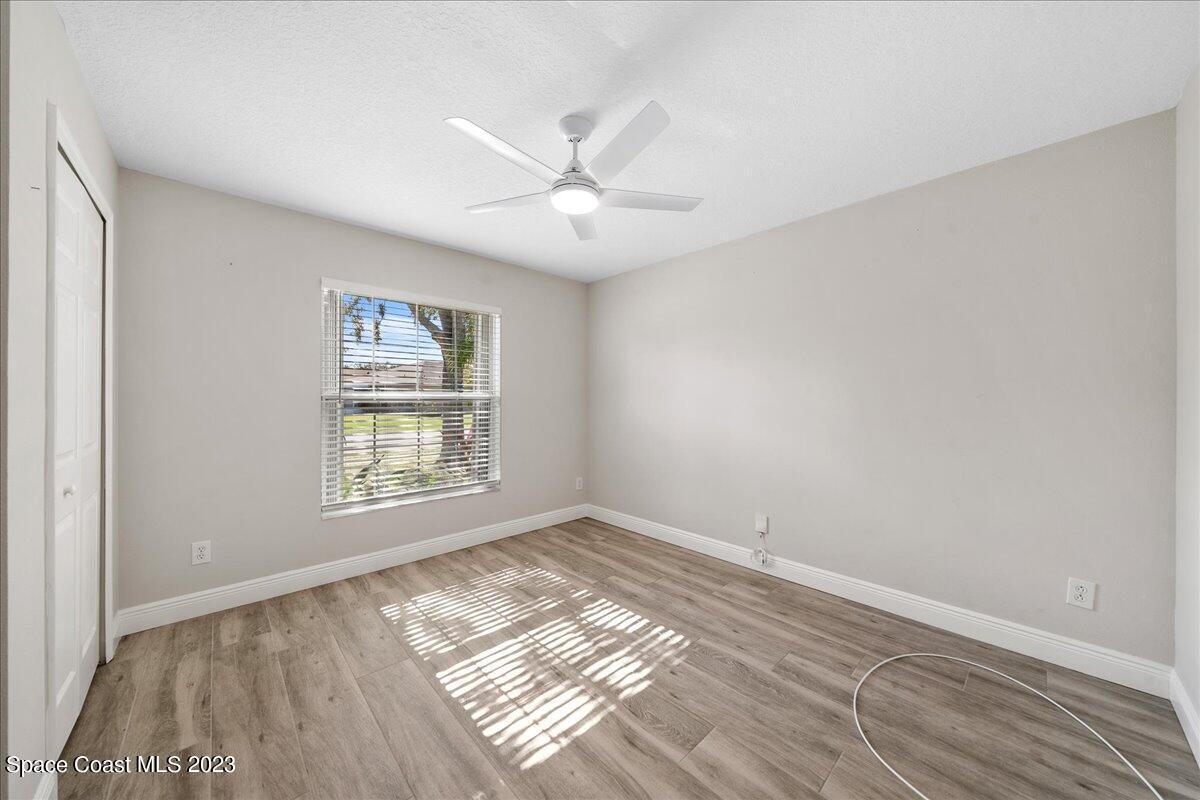 600 Benton Drive Melbourne, FL 32901 - Photo 24 of 33 a view of an empty room with a window and wooden floor