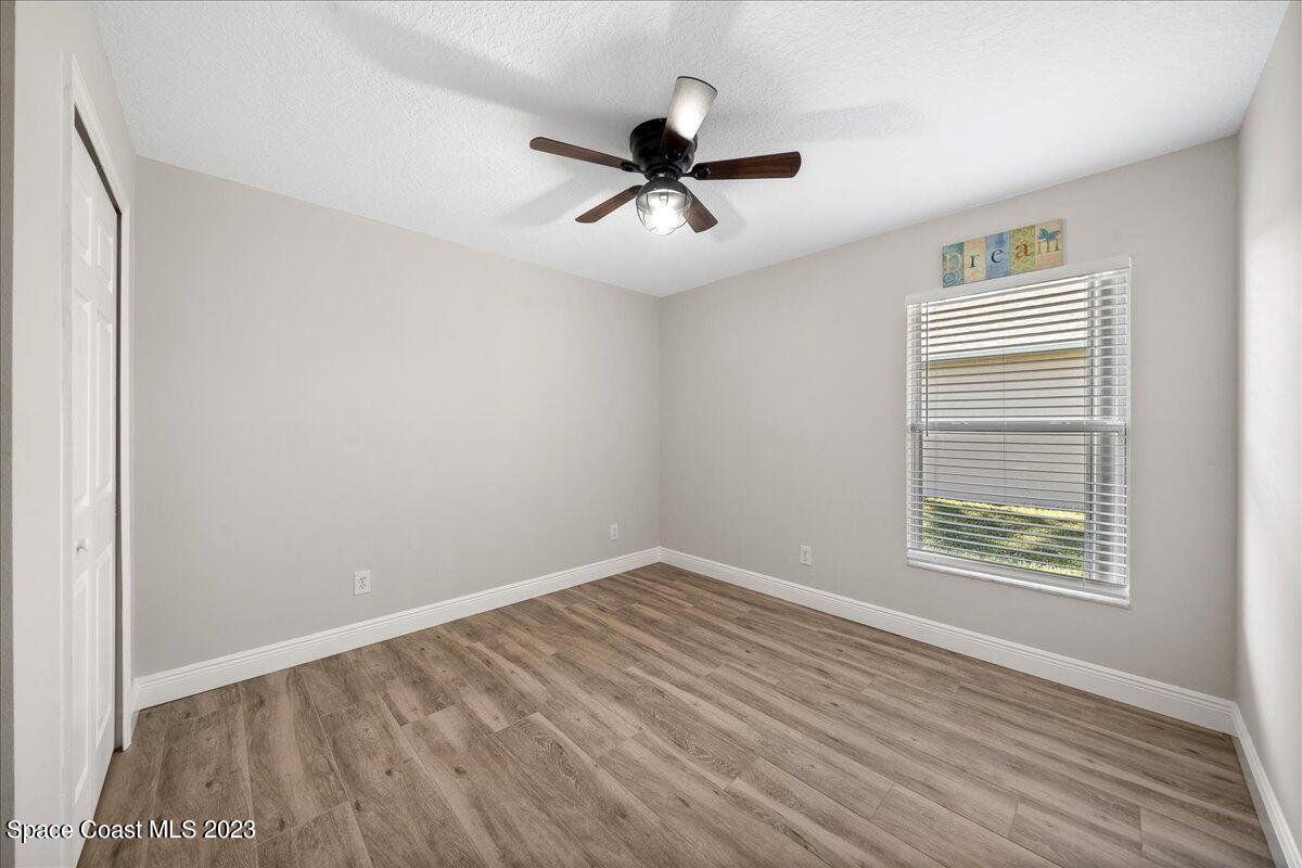 600 Benton Drive Melbourne, FL 32901 - Photo 25 of 33 wooden floor in an empty room with a window