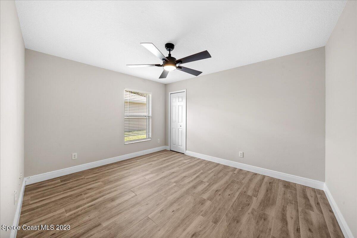 600 Benton Drive Melbourne, FL 32901 - Photo 26 of 33 wooden floor in an empty room with a window