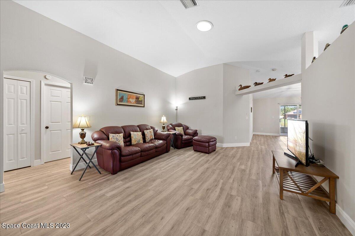 600 Benton Drive Melbourne, FL 32901 - Photo 7 of 33 a living room with furniture and a flat screen tv