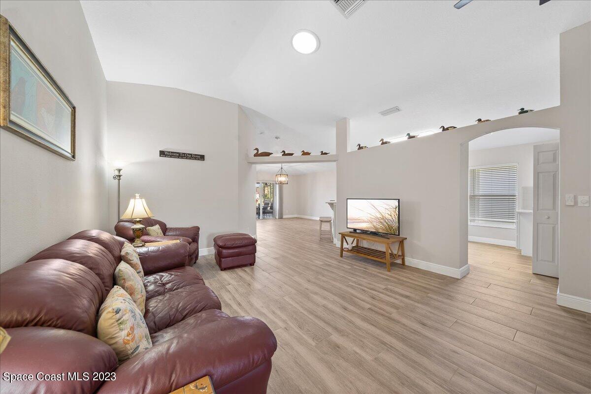 600 Benton Drive Melbourne, FL 32901 - Photo 8 of 33 a living room with furniture and a chandelier
