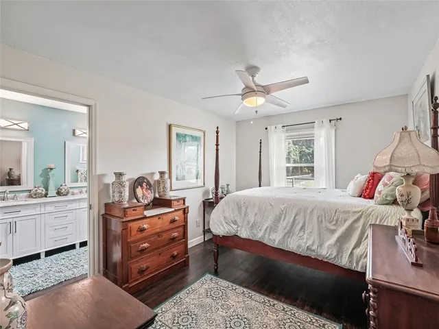 a bed room with a bed and a chandelier