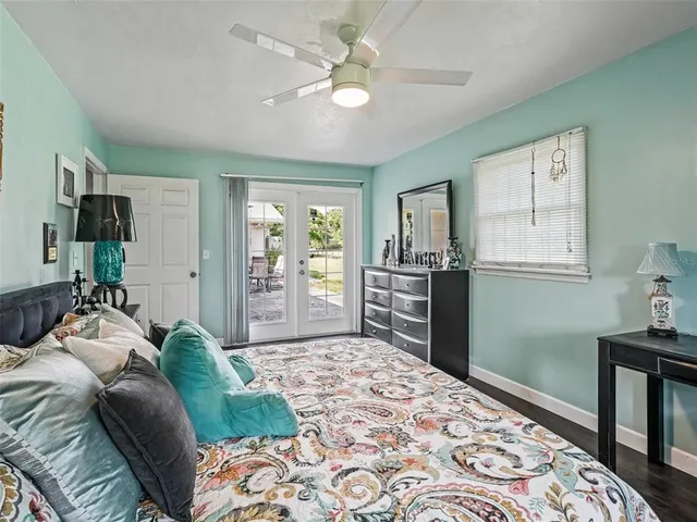 a bed room with a bed and a television