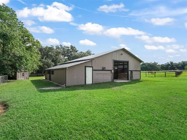 a backyard of a house with lots of green space