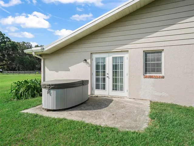 a view of a backyard with plants and a backyard