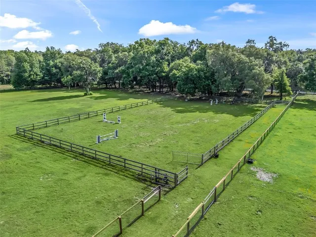 a view of a golf course with a big yard