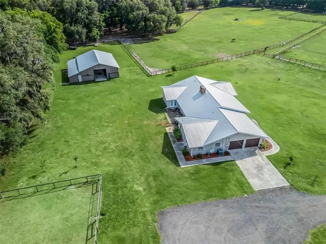 an aerial view of a house with a garden