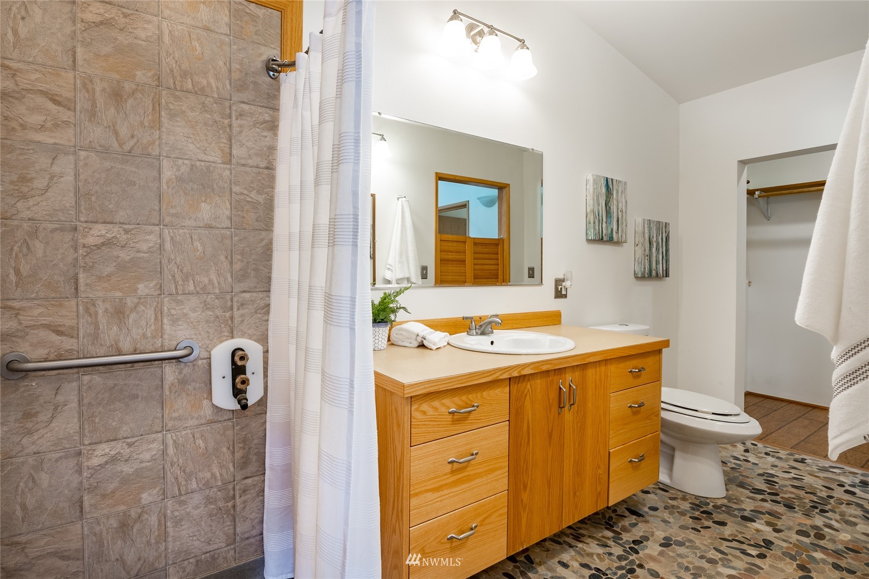 5604 Starry Road Bellingham, WA 98226 - Photo 15 of 40 a bathroom with a granite countertop sink toilet and shower