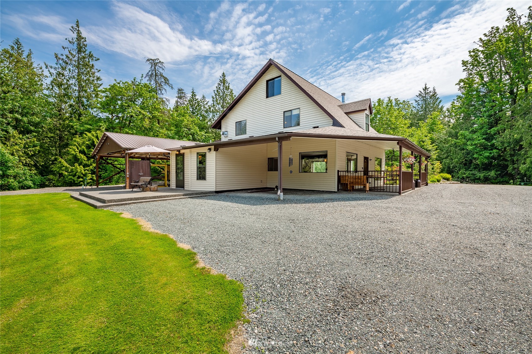 5604 Starry Road Bellingham, WA 98226 - Photo 28 of 40 a front view of a house with a yard table and chairs