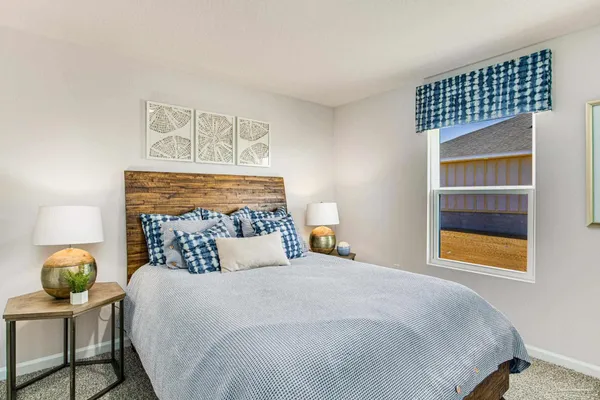 a bedroom with a bed and a dresser