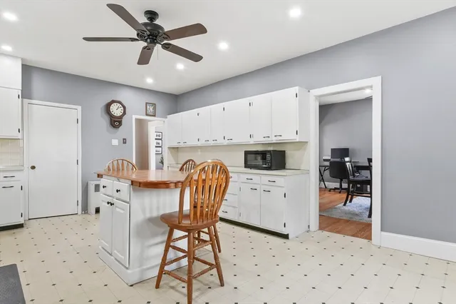 a view of kitchen with cabinets and outdoor space