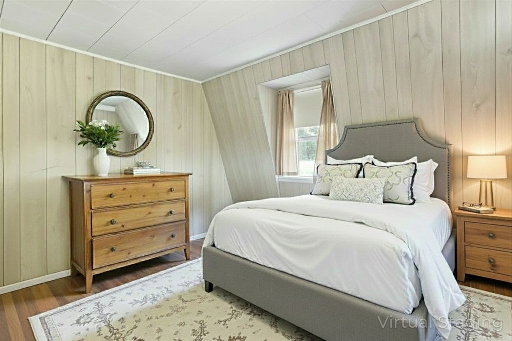 69 Eastern Avenue Woburn, MA 01801 - Photo 18 of 30 a bedroom with a bed and a dresser