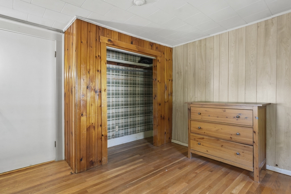69 Eastern Avenue Woburn, MA 01801 - Photo 20 of 30 wooden floor and chair in a room