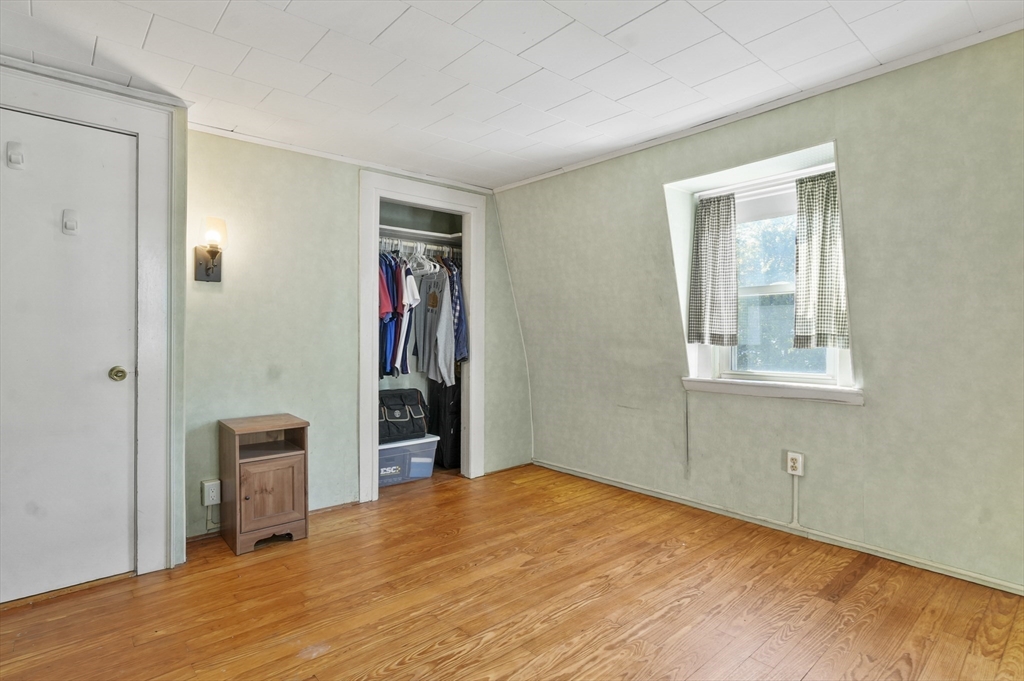 69 Eastern Avenue Woburn, MA 01801 - Photo 23 of 30 a bedroom with a bed and a window