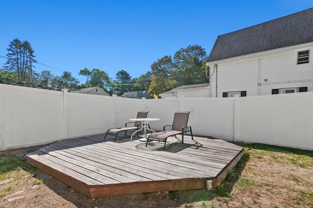 a view of a patio with a table and chairs