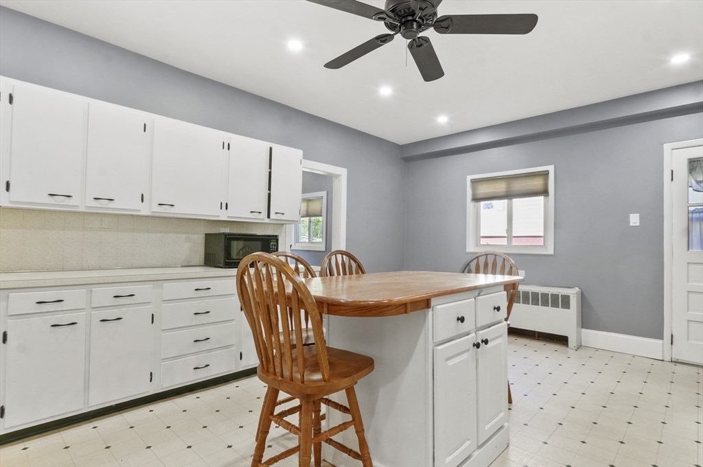 69 Eastern Avenue Woburn, MA 01801 - Photo 10 of 30 a dining room with furniture and window