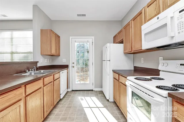 an empty room with closet and a bathroom