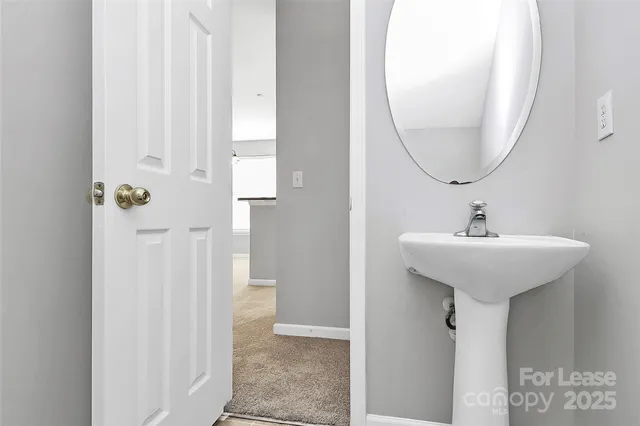 a view of empty room with a fireplace and window