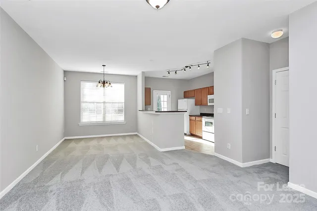 a view of an empty room with a fireplace