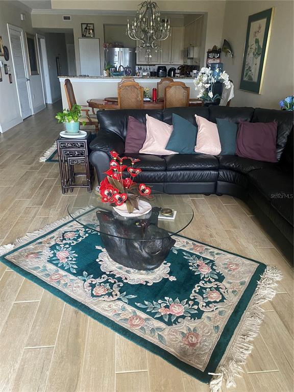 60 Surfview Drive, Unit 121 Palm Coast, FL 32137 - Photo 12 of 13 a living room with furniture and a table