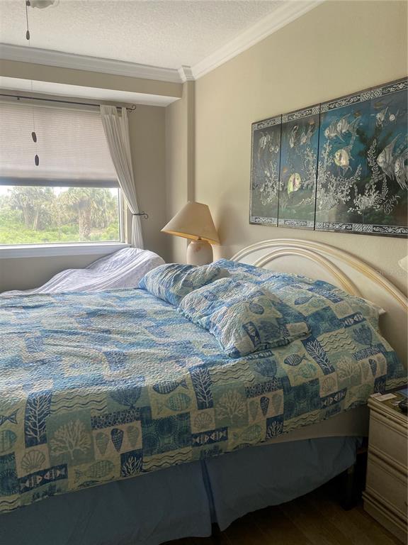 60 Surfview Drive, Unit 121 Palm Coast, FL 32137 - Photo 13 of 13 a bedroom with a bed and a window