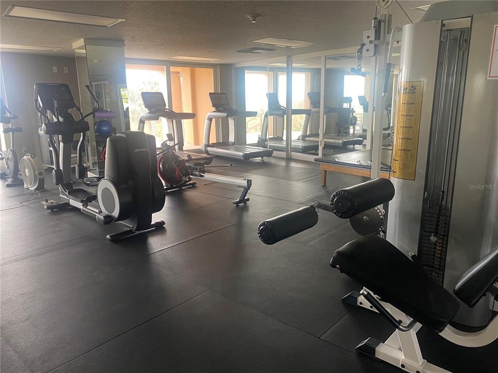 60 Surfview Drive, Unit 121 Palm Coast, FL 32137 - Photo 3 of 13 a gym hall with exercise machine