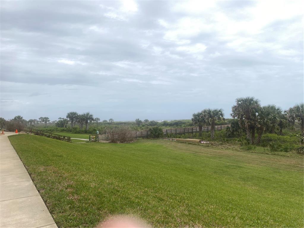 60 Surfview Drive, Unit 121 Palm Coast, FL 32137 - Photo 5 of 13 a view of a lake from a yard