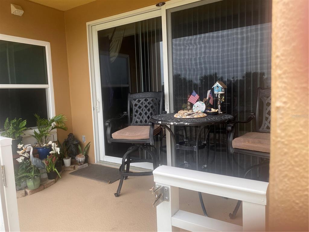 60 Surfview Drive, Unit 121 Palm Coast, FL 32137 - Photo 7 of 13 a dining room with furniture