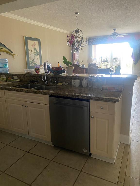 60 Surfview Drive, Unit 121 Palm Coast, FL 32137 - Photo 9 of 13 a kitchen with a sink and cabinets