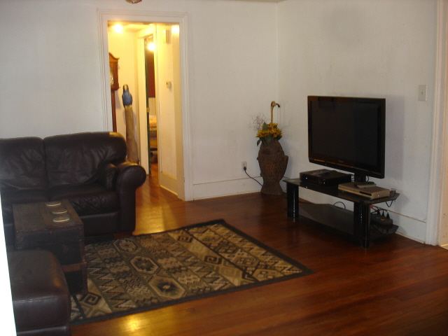 200 South Adams Ridott, IL 61067 - Photo 4 of 9 a living room with furniture and a flat screen tv