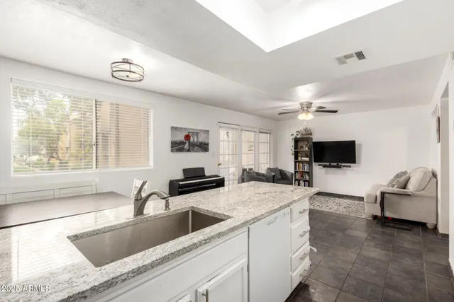 a kitchen with a stove a sink and a refrigerator