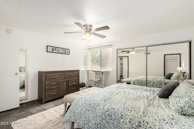 a bedroom with a bed and a dresser