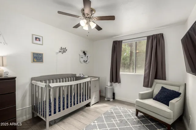 a bedroom with furniture and a window