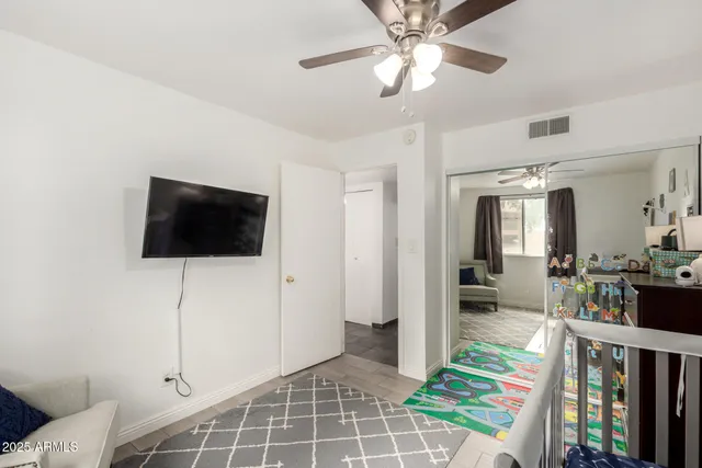 a view of a livingroom with furniture and workspace