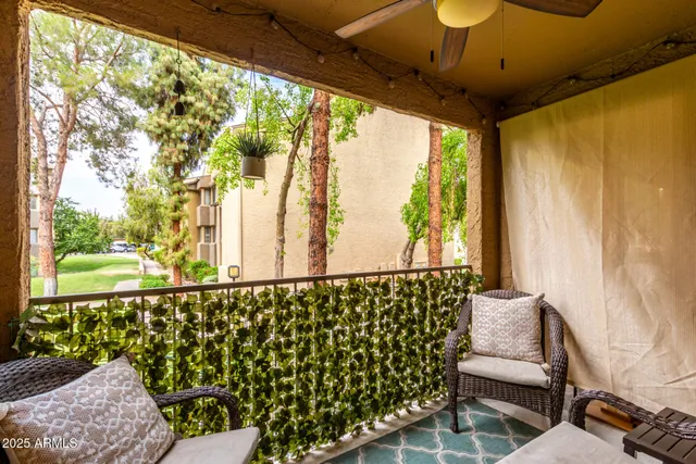 a view of a chair and table in the balcony