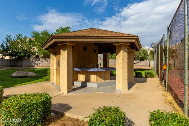 a view of a house with backyard and entertaining space