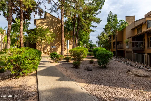 a view of a backyard with sitting area