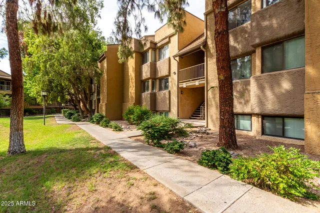 a view of a building with a yard