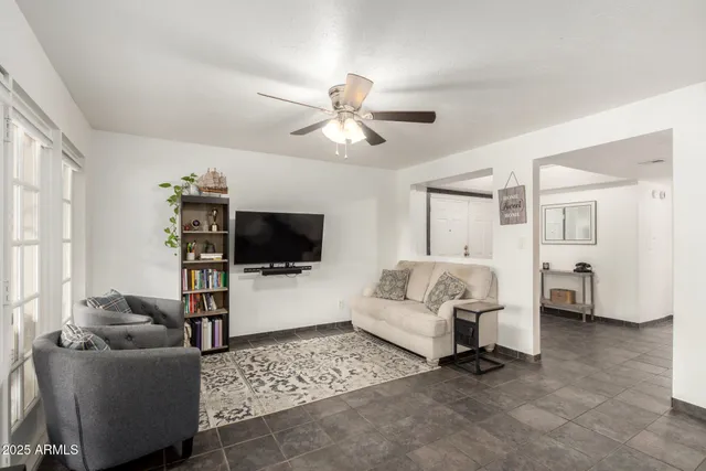 a living room with furniture and a flat screen tv