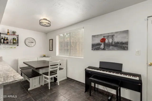 a view of a workspace with furniture