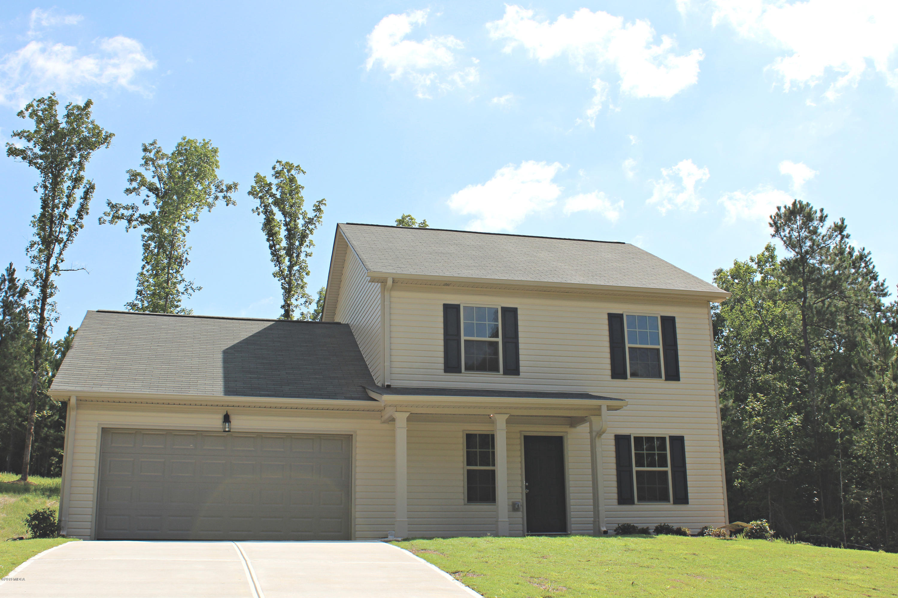 757 Weldon Road Forsyth, GA 31029 - Photo 1 of 8 a view of a house with a yard
