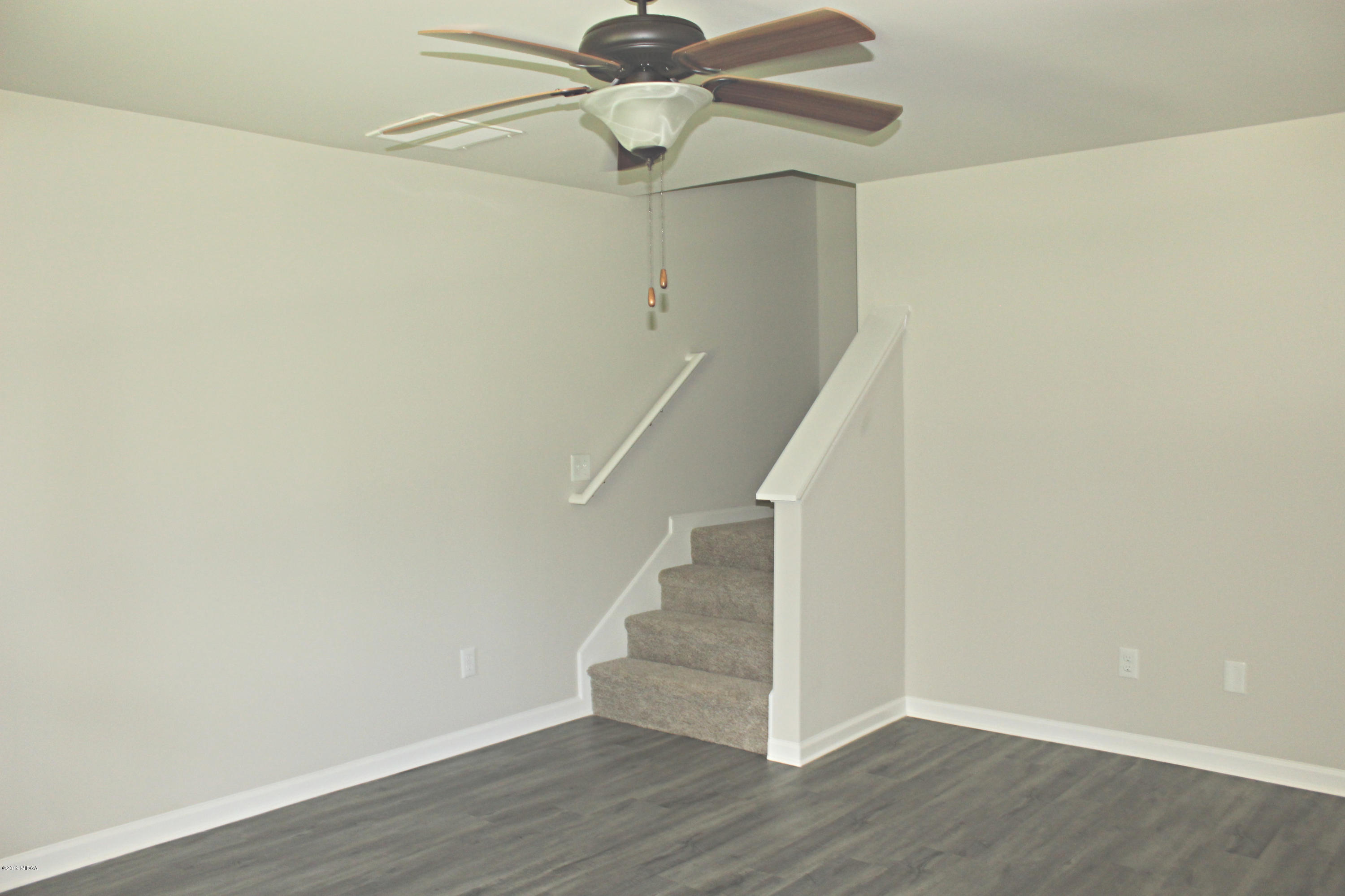757 Weldon Road Forsyth, GA 31029 - Photo 3 of 8 a view of entryway with wooden floor