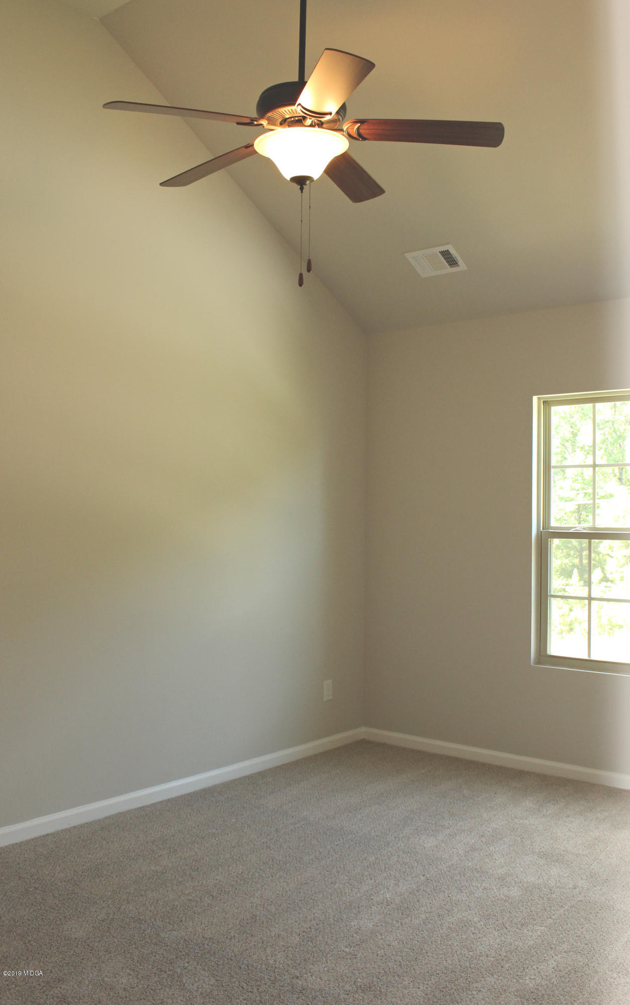 757 Weldon Road Forsyth, GA 31029 - Photo 6 of 8 a view of an empty room
