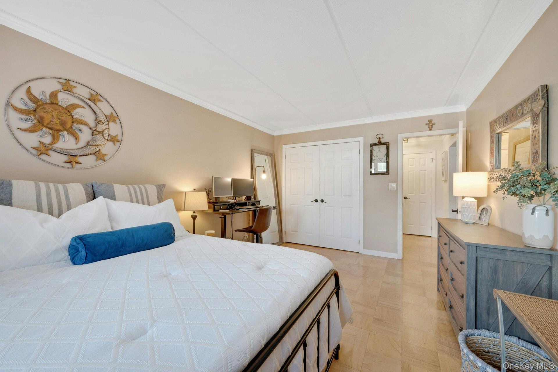 480 Halstead Avenue, Unit 2J Harrison, NY 10528 - Photo 12 of 16 a bedroom with a large bed and a chandelier