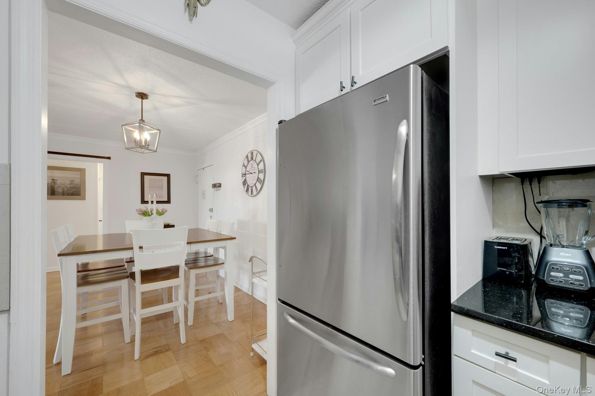 480 Halstead Avenue, Unit 2J Harrison, NY 10528 - Photo 10 of 16 a kitchen with cabinets and refrigerator